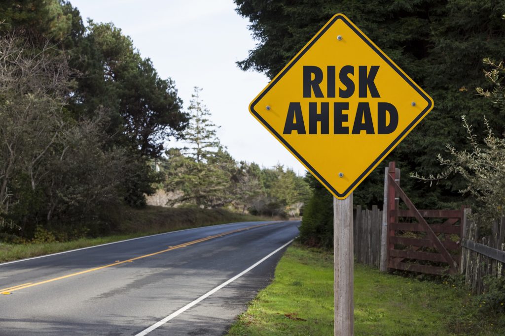 Risk ahead street sign